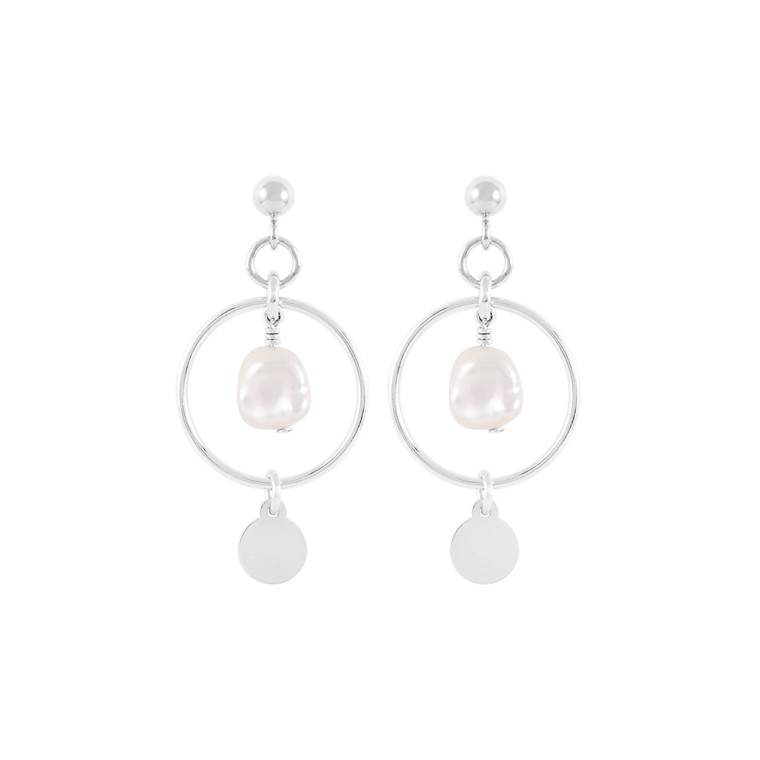 A pair of silver drop earrings with freshwater pearls enclosed in gold hoops.