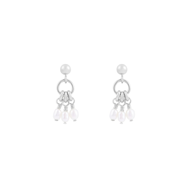 A pair of silver stud earrings with a ring centerpiece and suspended fresh water pearl details.