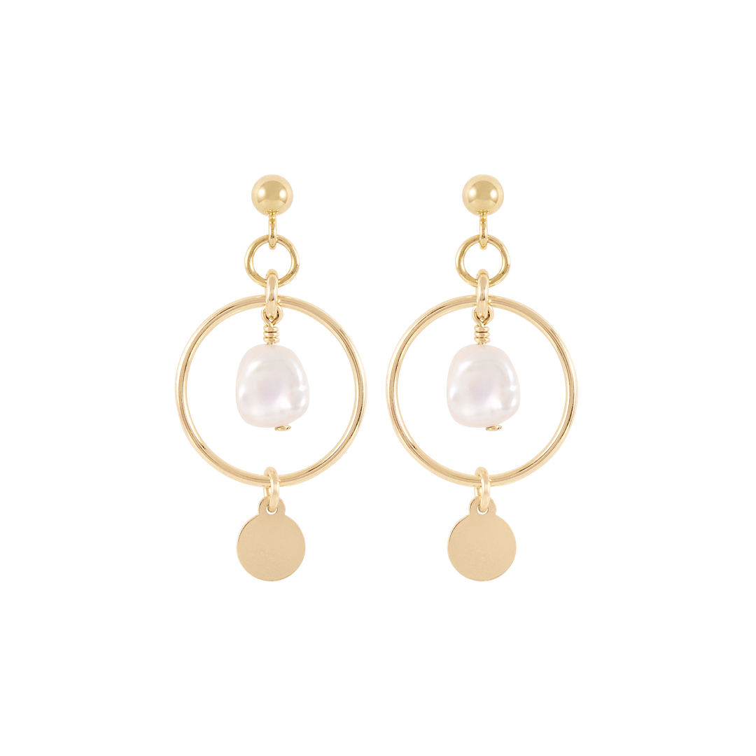 A pair of gold stud earrings featuring a freshwater pearl enclosed in a gold hoop.